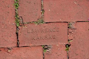 Brick in Lawrence with city name engraved on it